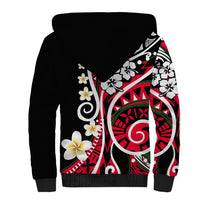 Black sherpa hoodie with white fleece-lined hood and large rear Polynesian print with flowers