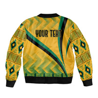 Yellow bomber jacket with green/black diagonal Kente print and ribbed hem; YOUR TEXT on back