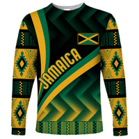Long-sleeve shirt with black, green, and yellow kente-style pattern, chest text detail