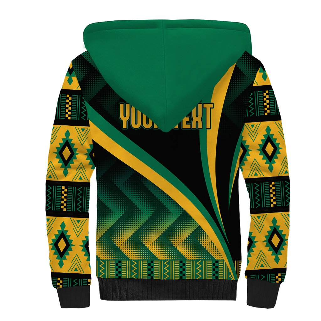 Black sherpa hoodie with green hood and large green/yellow kente graphic