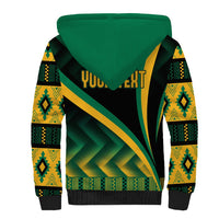 Black sherpa hoodie with green hood and large green/yellow kente graphic