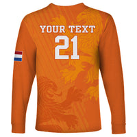 Orange long-sleeve soccer shirt back with YOUR TEXT 21 and striped flag sleeve