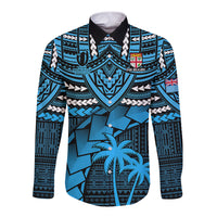 Blue Fiji-style long sleeve button rugby shirt with tribal crest and palm tree print