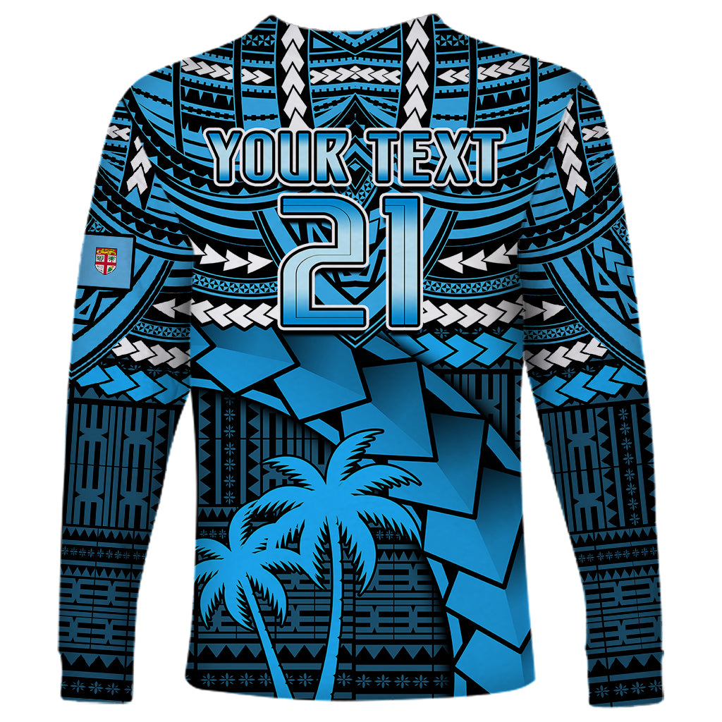 Blue long-sleeve rugby shirt with geometric print, palm tree, and large custom text