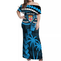 Blue off-shoulder maxi dress with tribal chevrons, shield graphic, and palm print