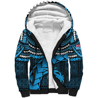 Blue sherpa-lined hoodie with patterned tribal print and black hood trim