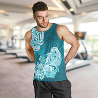 Aqua men’s tank top with white floral tribal graphic, worn by model