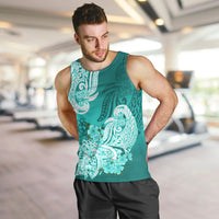 Men's turquoise tank top on model with white floral tribal graphic, sleeveless.