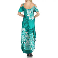 Turquoise back-view maxi dress with cold shoulders and floral tribal pattern