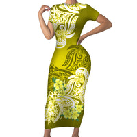 Yellow bodycon dress with short sleeves, fitted waist, bold floral tribal print
