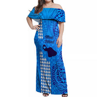 Blue off-shoulder maxi dress with ruffled neckline and mixed tribal pattern, front view