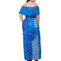 Blue off-shoulder maxi dress with ruffled neckline and tribal print, back view