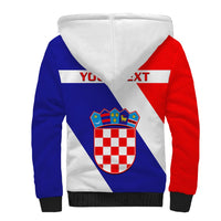 Sherpa zip hoodie with red/blue/white back print, white hood, black ribbed cuffs