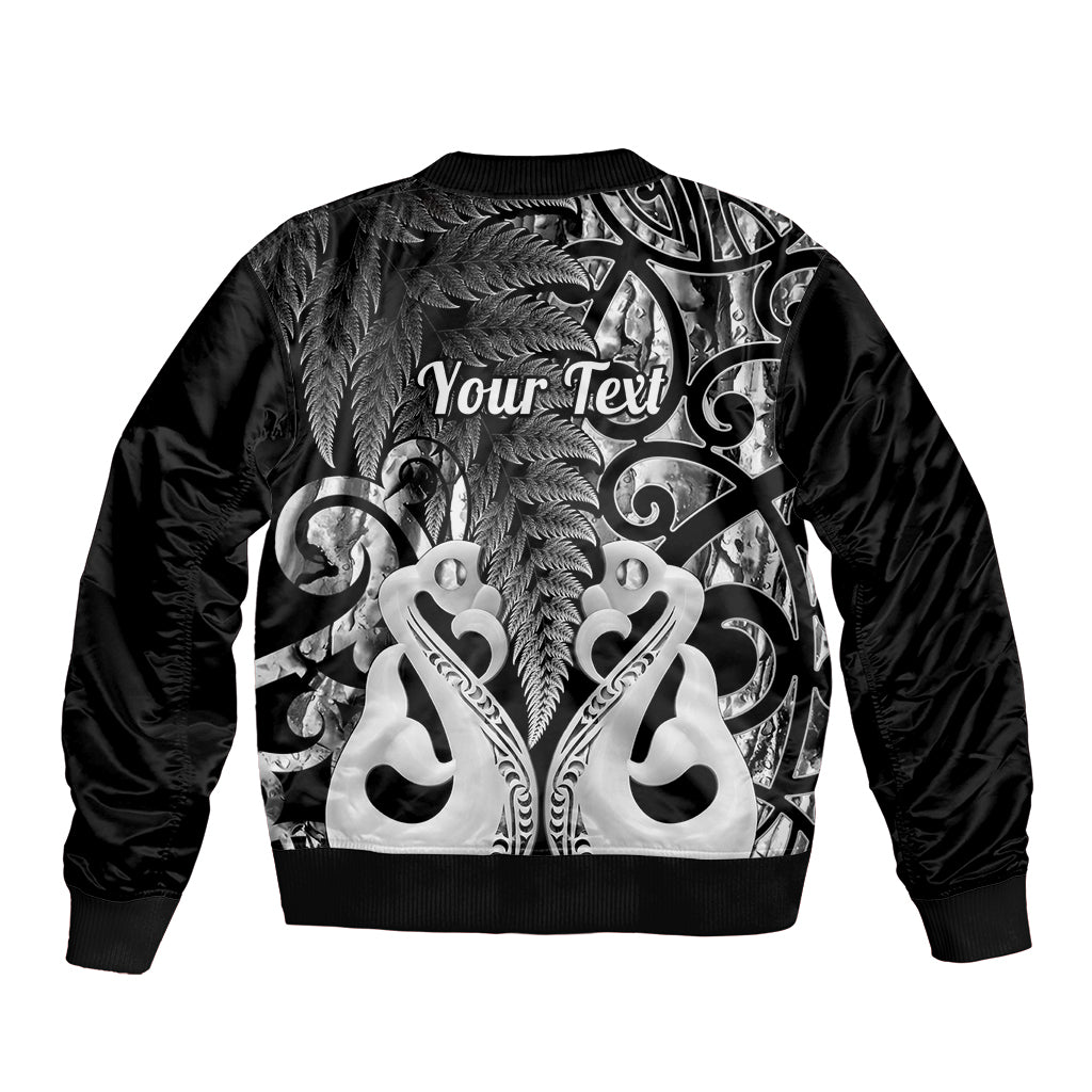 Black bomber jacket back with large fern graphic and "Your Text" lettering