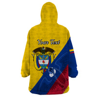 Yellow wearable blanket hoodie with hood, back graphic and “Your Text” over Colombia design