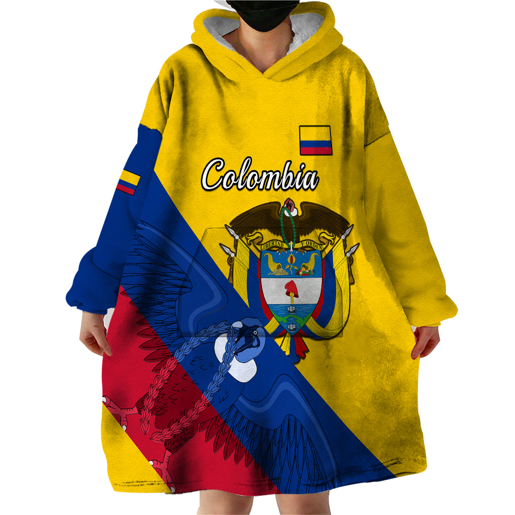 Yellow wearable blanket hoodie with hood, large front Colombia coat of arms and condor graphic
