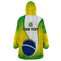Wearable blanket hoodie, back view with placeholder text, green and yellow with Brazil crest