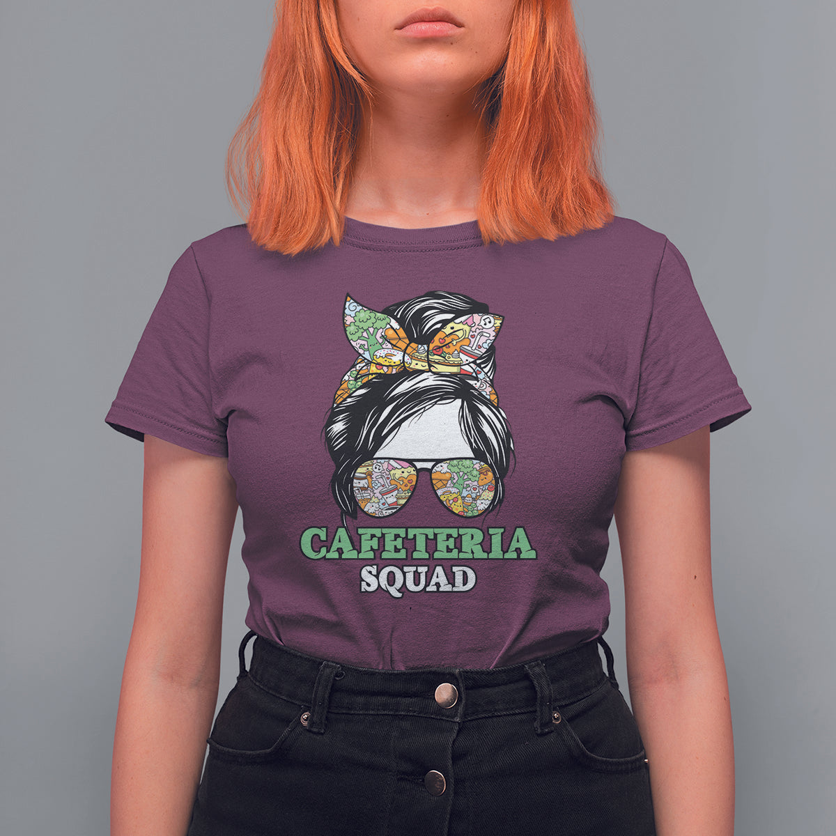 Women’s maroon graphic t-shirt with “CAFETERIA SQUAD” cat print