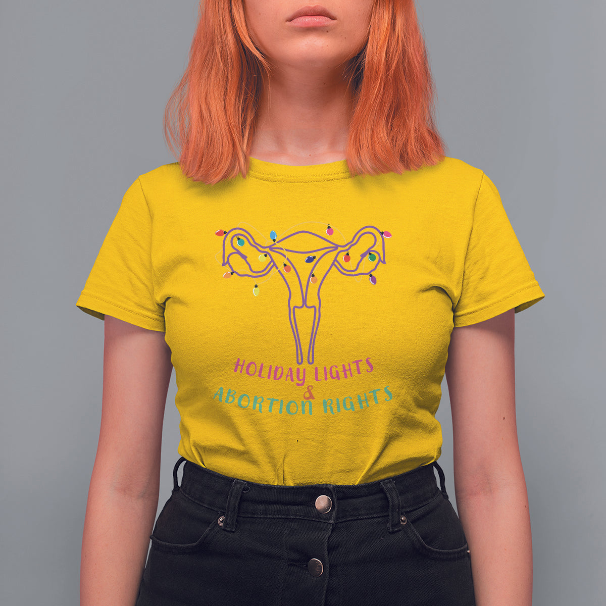 Women's daisy yellow graphic T-shirt with colorful lights and uterus-themed message