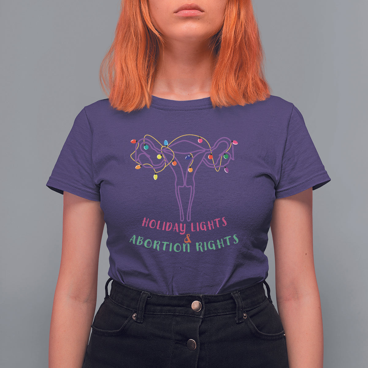 Women's purple graphic T-shirt with colorful lights and uterus-themed message