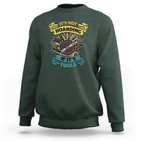 Dark forest green sweatshirt with multicolor woodworker tools graphic on the chest