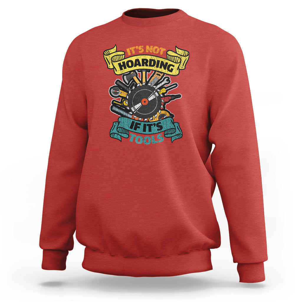 Red sweatshirt with multicolor woodworker tools graphic on the chest