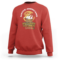 Red crewneck sweatshirt with “Discovered Columbus 1492” graphic on chest
