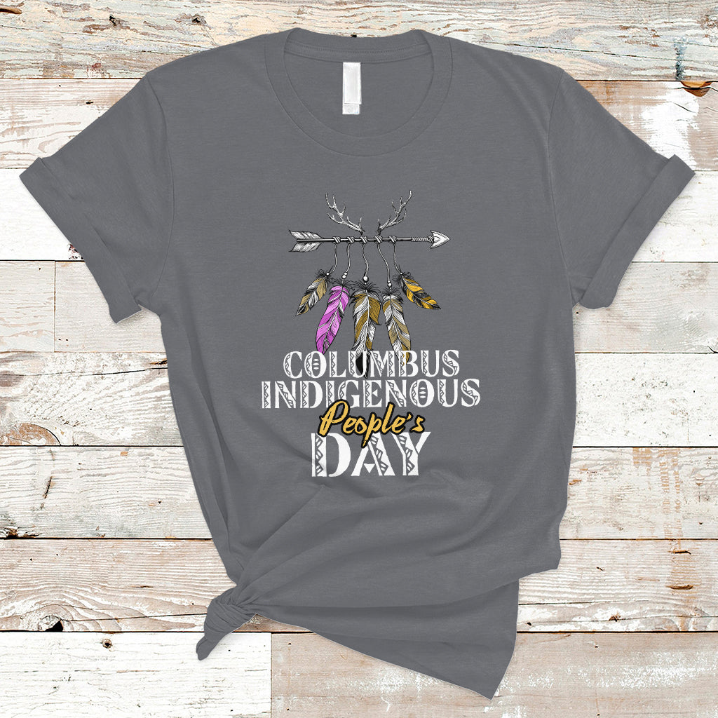 Charcoal gray T-shirt with colorful feather arrow graphic and “Columbus Indigenous People’s Day” text