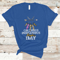 Royal blue T-shirt with colorful feather arrow graphic and “Columbus Indigenous People’s Day” text