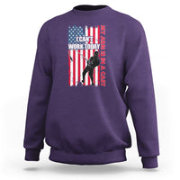 Purple crewneck sweatshirt with patriotic graphic and text on chest, long sleeves