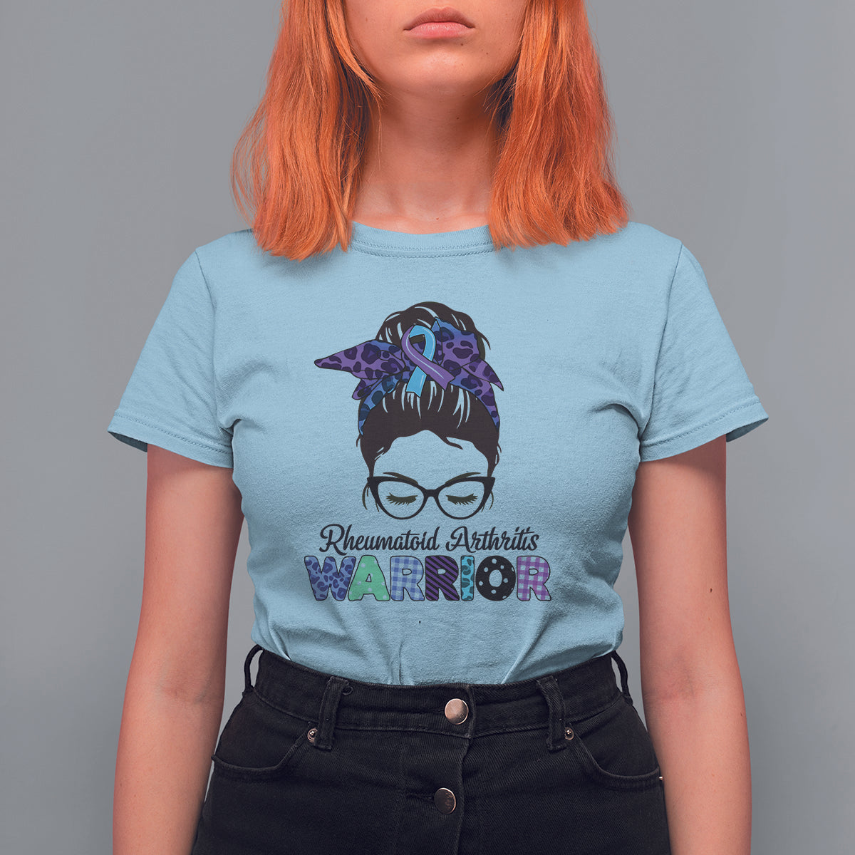 Women’s light blue short-sleeve T-shirt with messy-bun warrior ribbon graphic and glasses