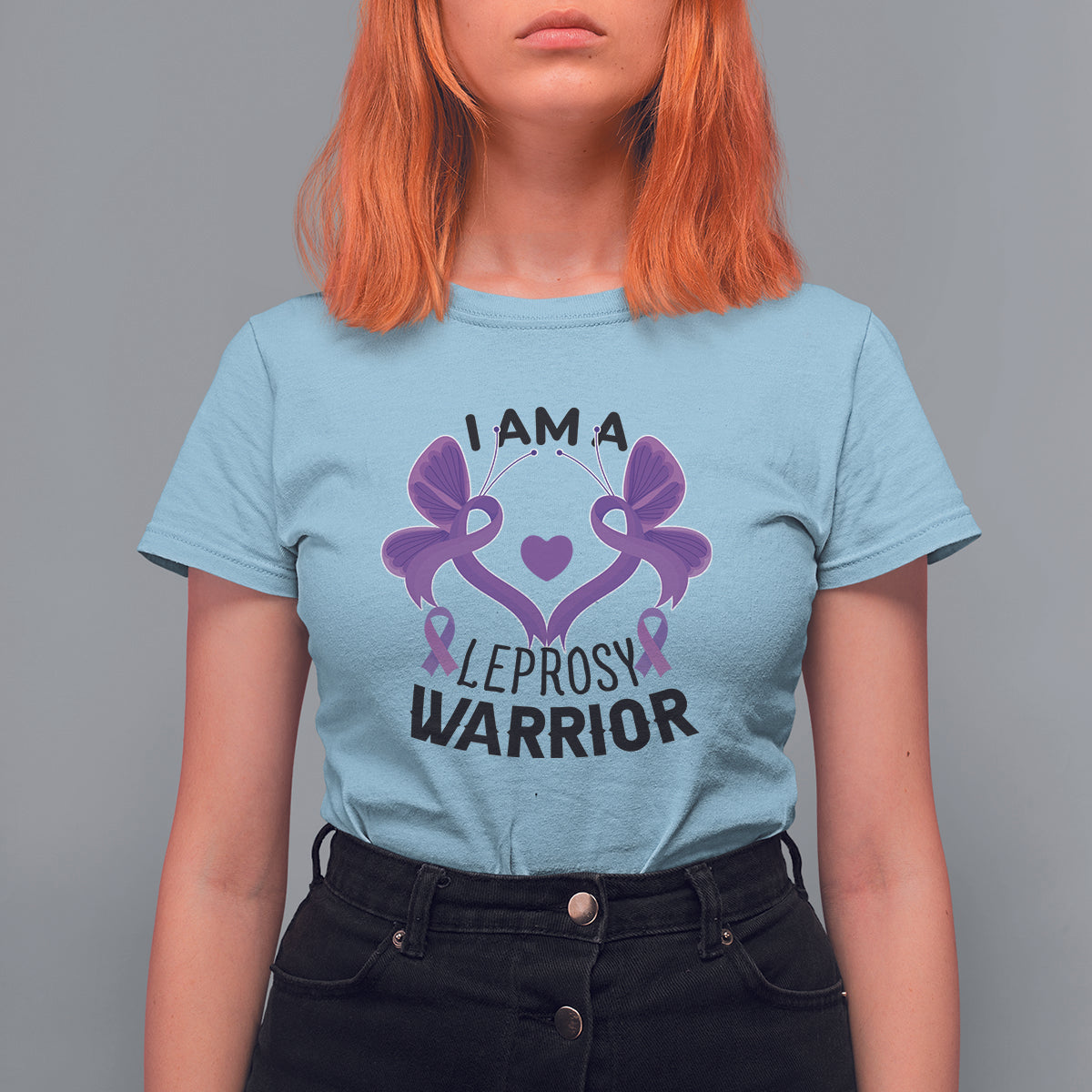 Women’s graphic T-shirt, light blue with purple ribbon-and-butterfly “I AM A… WARRIOR” print