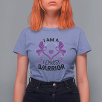 Women’s graphic T-shirt, periwinkle blue with purple ribbon-and-butterfly “I AM A… WARRIOR” print