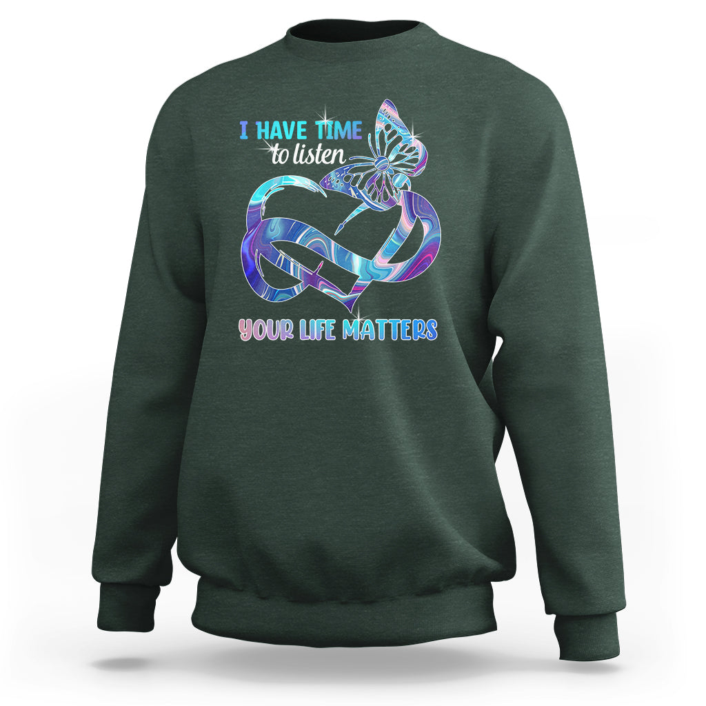 Dark forest green sweatshirt with colorful butterfly graphic and “I have time to listen / Your life matters”.
