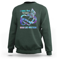 Dark forest green sweatshirt with colorful butterfly graphic and “I have time to listen / Your life matters”.