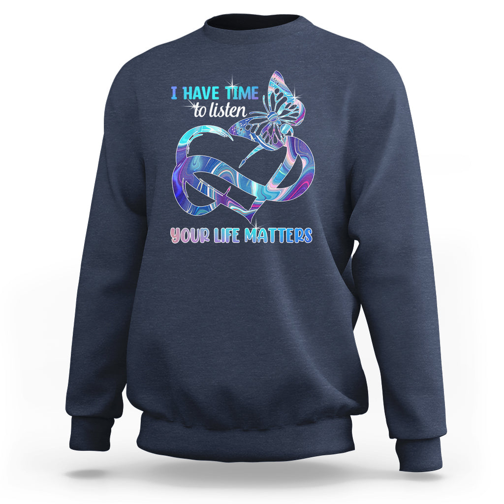 Navy sweatshirt with colorful butterfly graphic and “I have time to listen / Your life matters”.