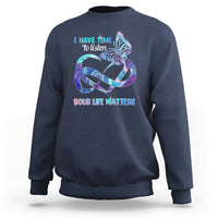 Navy sweatshirt with colorful butterfly graphic and “I have time to listen / Your life matters”.