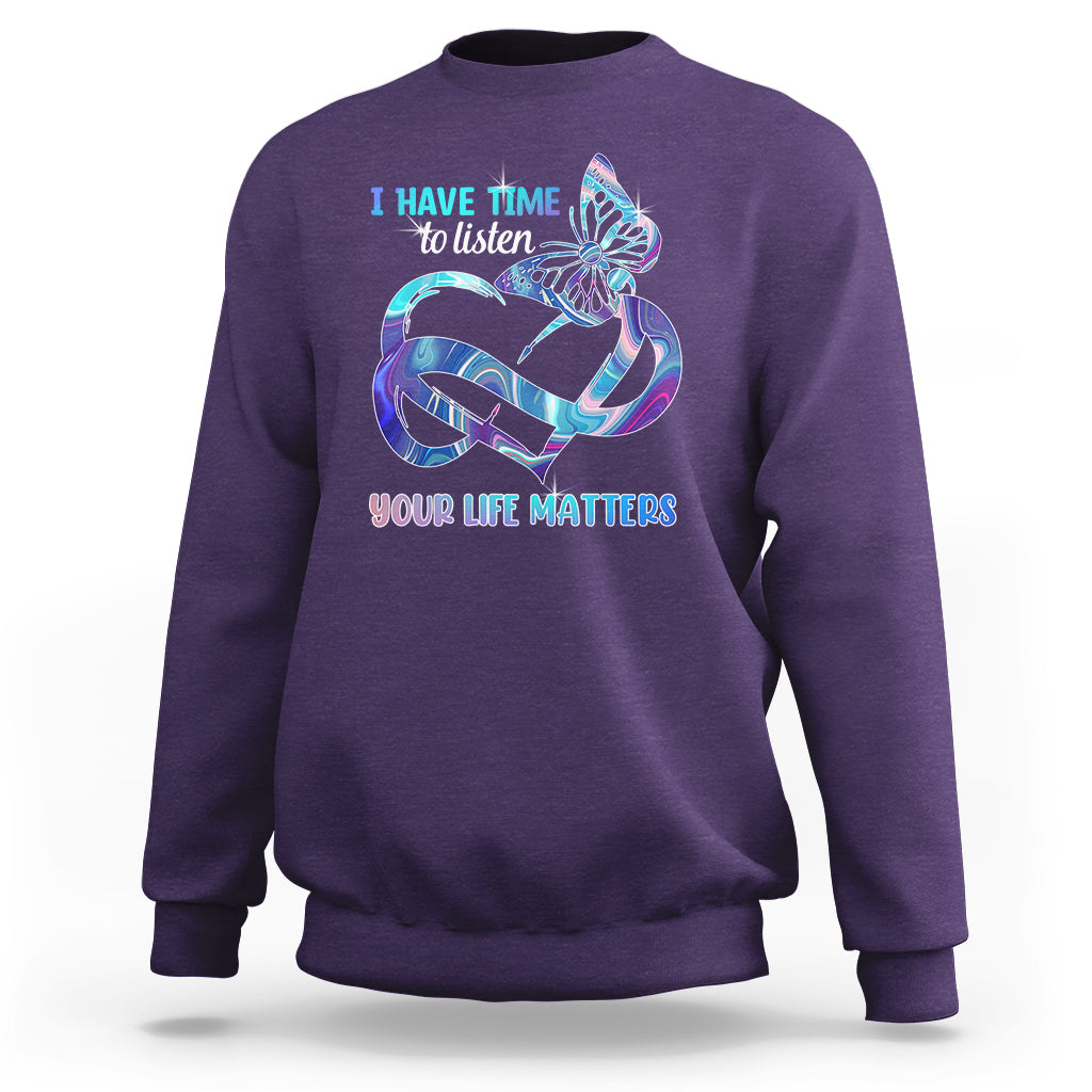 Purple sweatshirt with colorful butterfly graphic and “I have time to listen / Your life matters”.