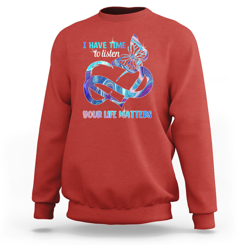 Red sweatshirt with colorful butterfly graphic and “I have time to listen / Your life matters”.