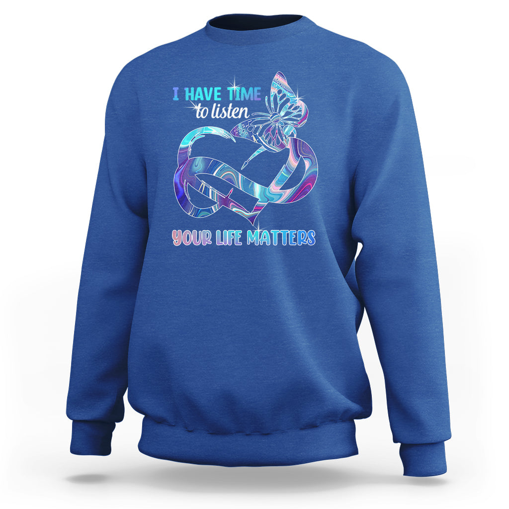 Royal blue sweatshirt with colorful butterfly graphic and “I have time to listen / Your life matters”.