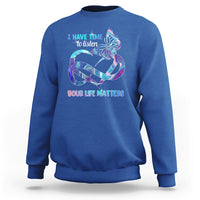 Royal blue sweatshirt with colorful butterfly graphic and “I have time to listen / Your life matters”.