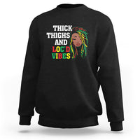 Black crewneck sweatshirt with 'THICK THIGHS AND LOC'D VIBES' front graphic
