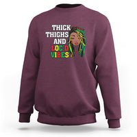 Maroon crewneck sweatshirt with 'THICK THIGHS AND LOC'D VIBES' front graphic
