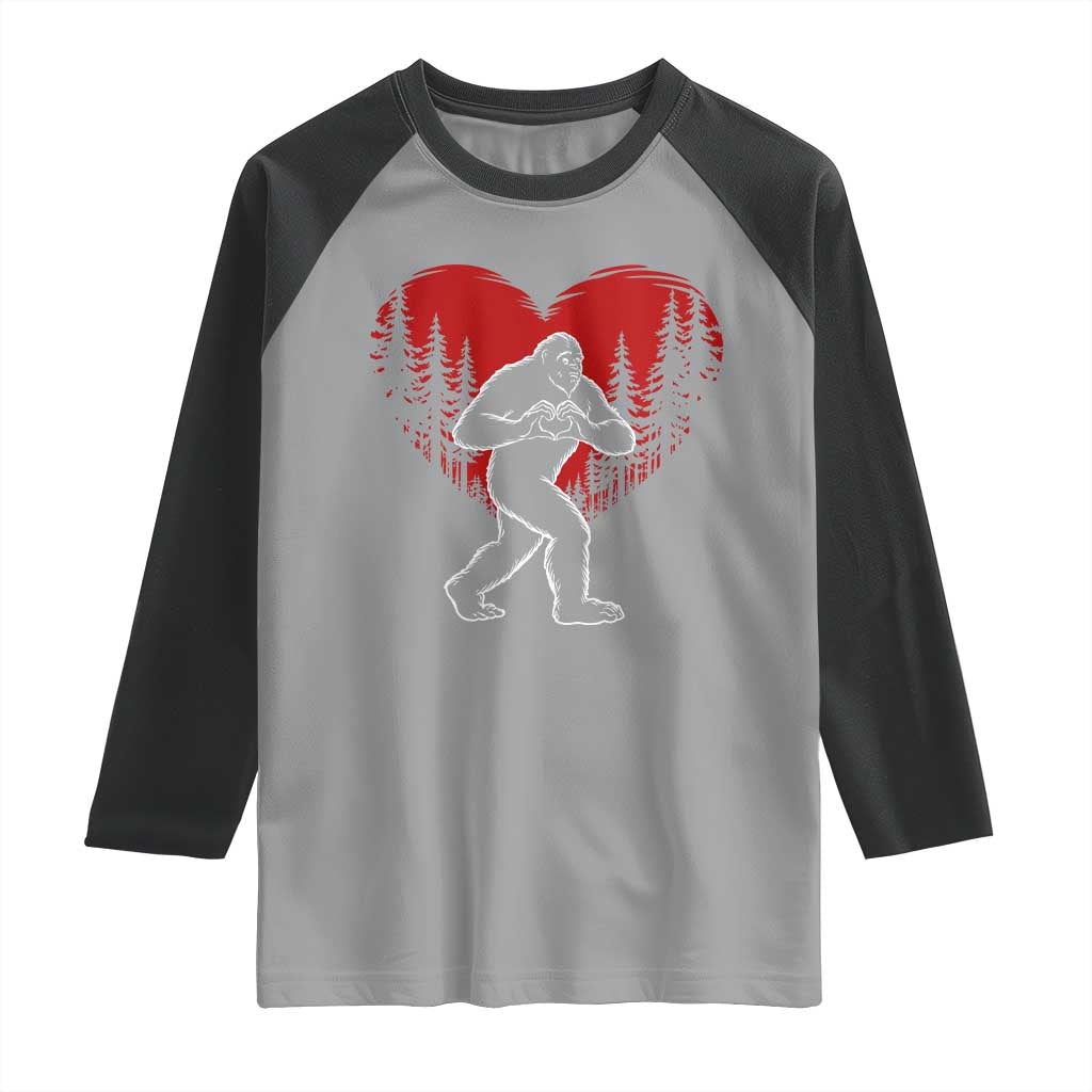 Funny Valentine Bigfoot in Love Heart Hand Sign Raglan Shirt Romantic Sasquatch in Forest Valentines Day