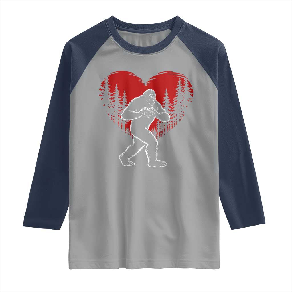 Funny Valentine Bigfoot in Love Heart Hand Sign Raglan Shirt Romantic Sasquatch in Forest Valentines Day