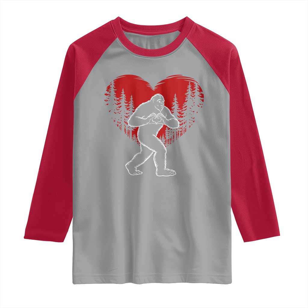 Funny Valentine Bigfoot in Love Heart Hand Sign Raglan Shirt Romantic Sasquatch in Forest Valentines Day