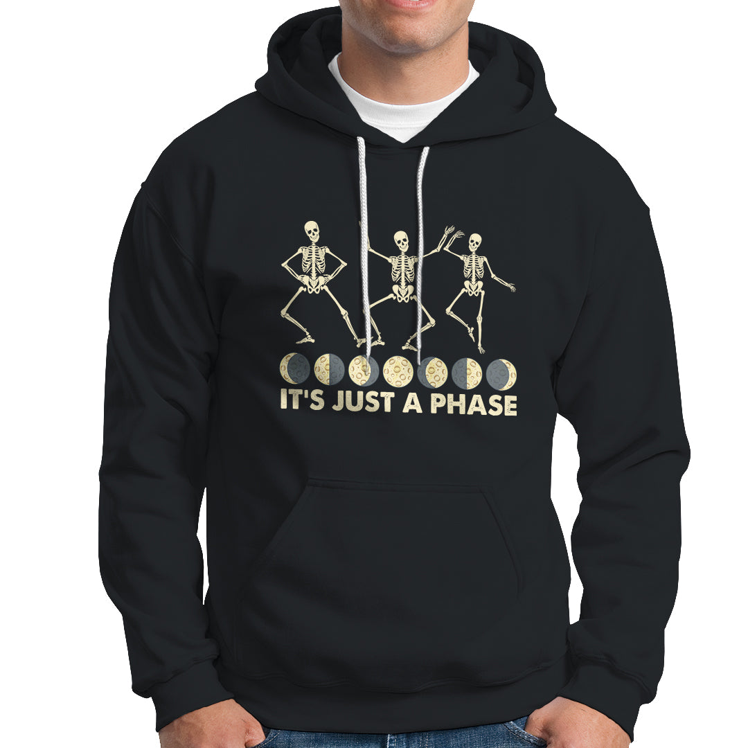 Black hoodie with moon-phase skeleton dancers graphic and 'It's Just A Phase' text