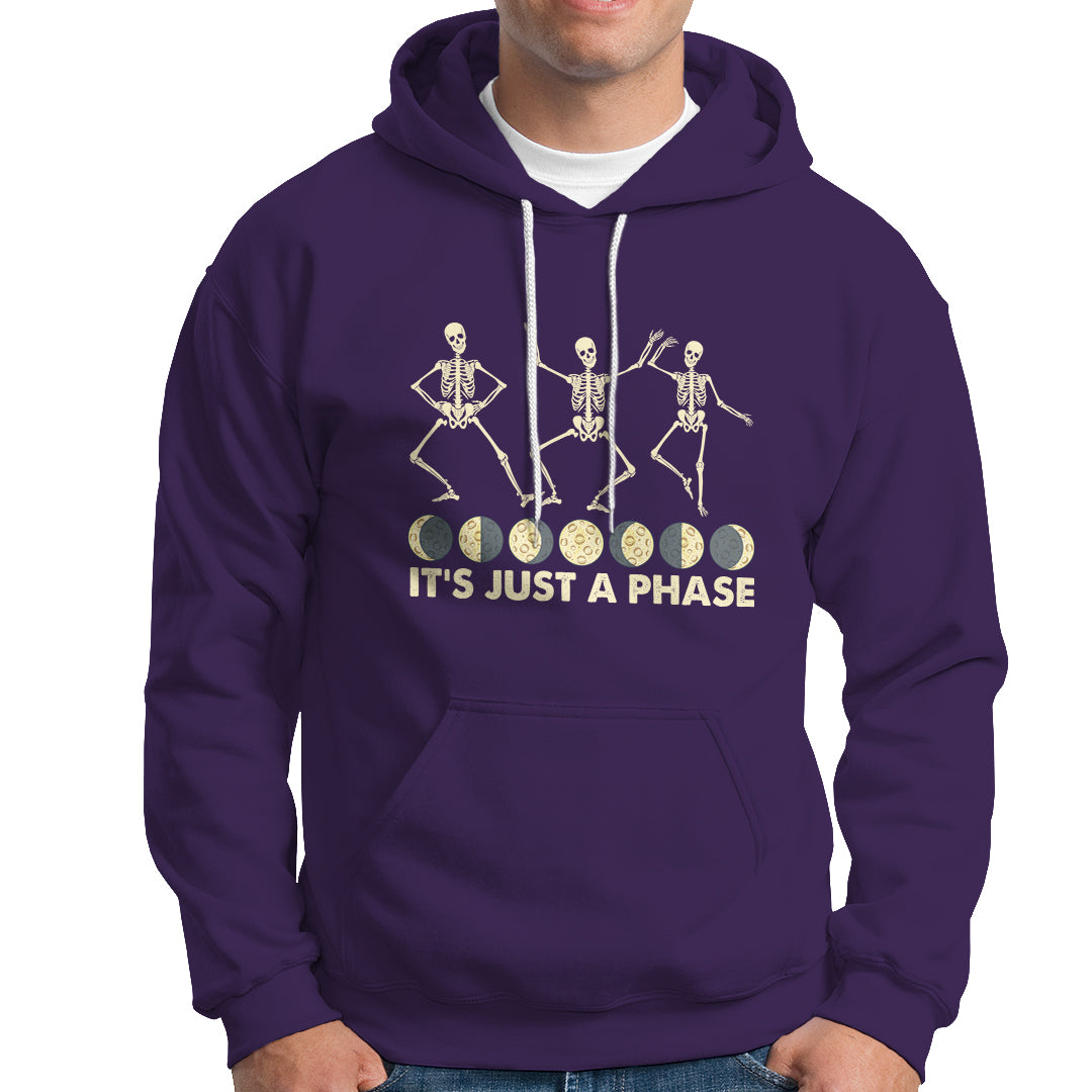 Purple hoodie with moon-phase skeleton dancers graphic and 'It's Just A Phase' text