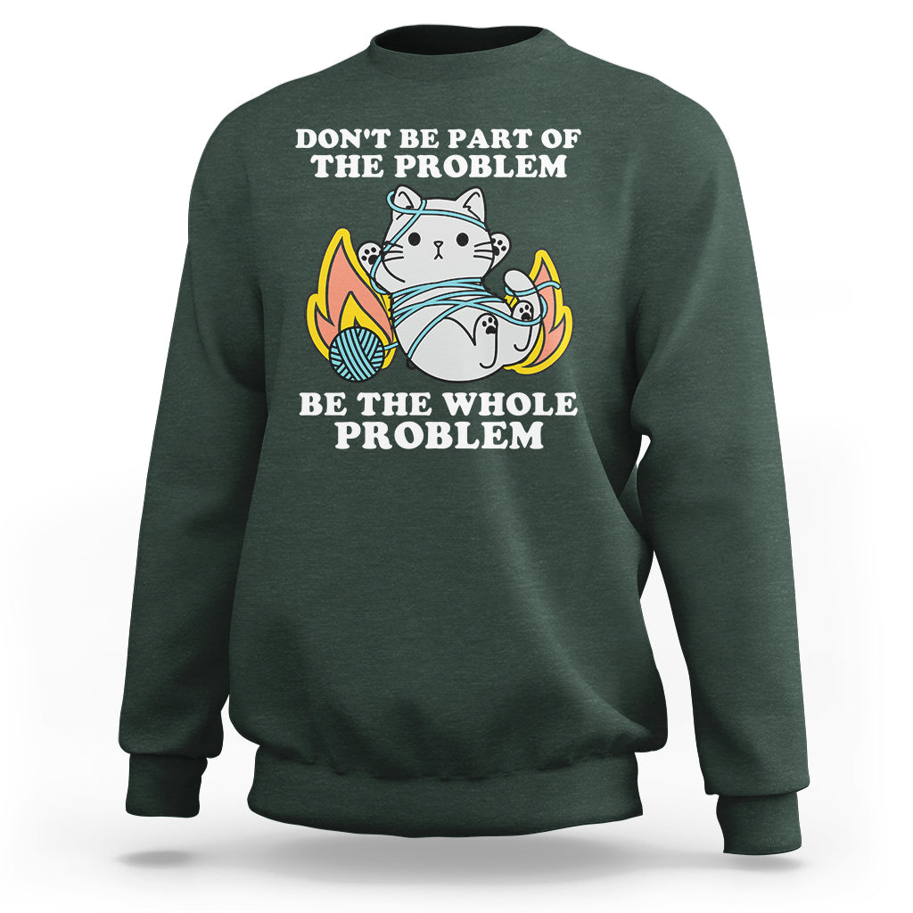 Dark forest green crewneck sweatshirt with cat graphic and 'BE THE WHOLE PROBLEM' text