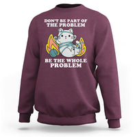 Maroon crewneck sweatshirt with cat graphic and 'BE THE WHOLE PROBLEM' text